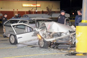 A couple in their 80s was killed after their car struck the concrete base of a pole in a parking lot.