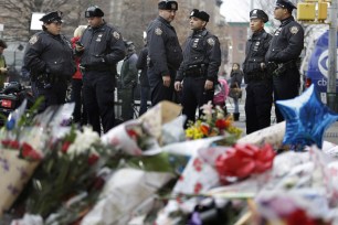 Memorial for executed NYPD cops draws steady stream of visitors