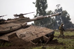 An Israeli soldiers of the Golani brigade trains in the Israeli controlled Golan Heights, near the Israel-Syria border.. Hezbollah said Monday that an Iranian general was killed in what they called an Israeli air strike.