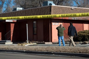 Colorado Springs police officers investigate the scene of the NAACP bombing.