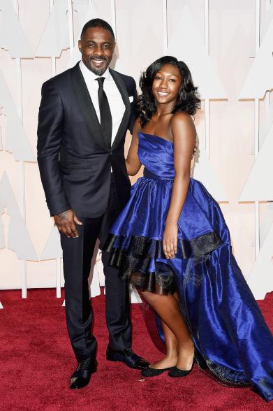 HOLLYWOOD, CA - FEBRUARY 22: Actor Idris Elba (L) and Isan Elba attend the 87th Annual Academy Awards at Hollywood & Highland Center on February 22, 2015 in Hollywood, California. (Photo by Jason Merritt/Getty Images)