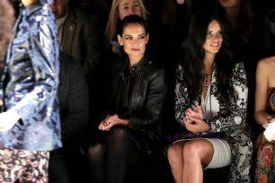 Katie Holmes and Adriana Lima attend the Desigual fashion show during Fashion Week on Feb. 12.