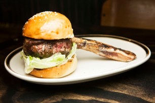 M. Wells Steakhouse serves the Bone In Burger - a burger of brisket and dry aged prime round.