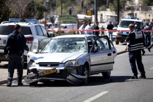 Israeli police at the scene after a Palestinian rammed his car into a group of Israeli pedestrians, including four policewomen.