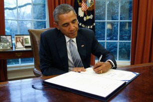 President Barack Obama signs the Dept. of Homeland Security Appropriations Act in Washington.