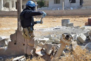 A UN investigator at the scene of the Syria gas attack in August 2013.