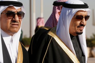 Saudi Arabia's King Salman (right) and Deputy Crown Prince Mohammed bin Nayef walk to greet President Obama in Riyadh on January 27.