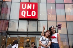 Selfie takers have flocked to Uniqlo's flagship store in Beijing after the sexy video spread across the internet.