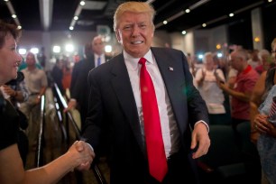 Donald Trump shakes a supporter's hand in South Carolina on July 21.