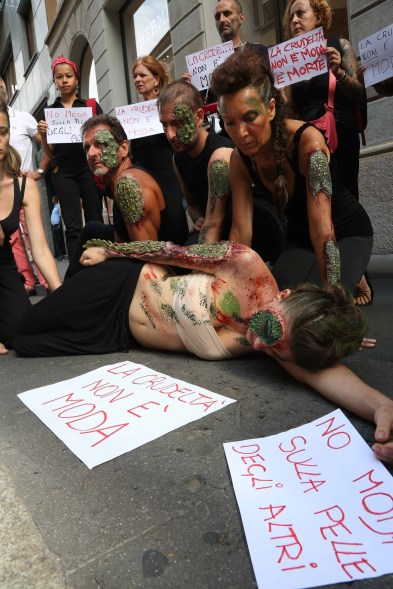 Protesters rally outside a Hermès store in Milan against the designer's exploitation of crocodiles.