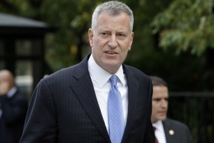 Bill de Blasio arrives at city hall on September 21.