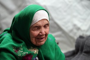 105-year old Afghan refugee Bibihal Uzbeki rests in Croatia's main refugee camp near the border with Serbia on Oct. 27.