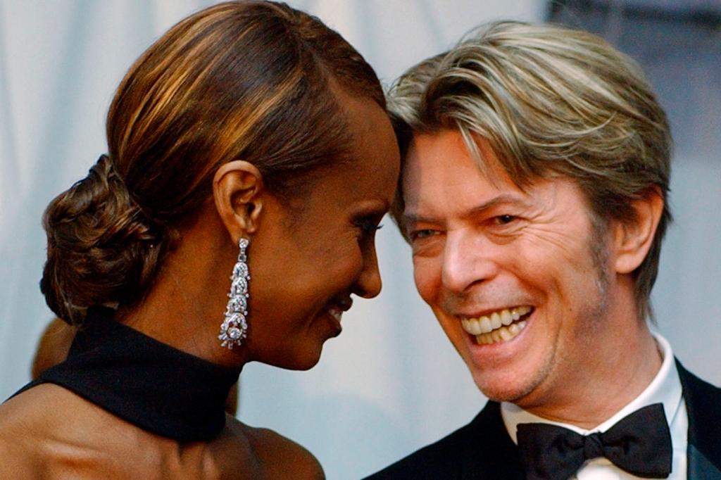 FILE - In this June 3, 2002, file photo, Iman, left, and her husband, singer David Bowie arrive at the Council of Fashion Designers of America Fashion Awards in New York. Bowie, the innovative and iconic singer whose illustrious career lasted five decades, died Monday, Jan. 11, 2016, after battling cancer for 18 months. He was 69. (AP Photo/Suzanne Plunkett, File)