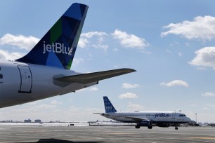 A JetBlue airplane taxies on the tarmac at Kennedy Airport on March 16.