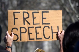 A sign reading "Free Speech"