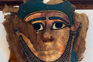 A recently discovered gilded mummy mask dating back some 2,500 years.