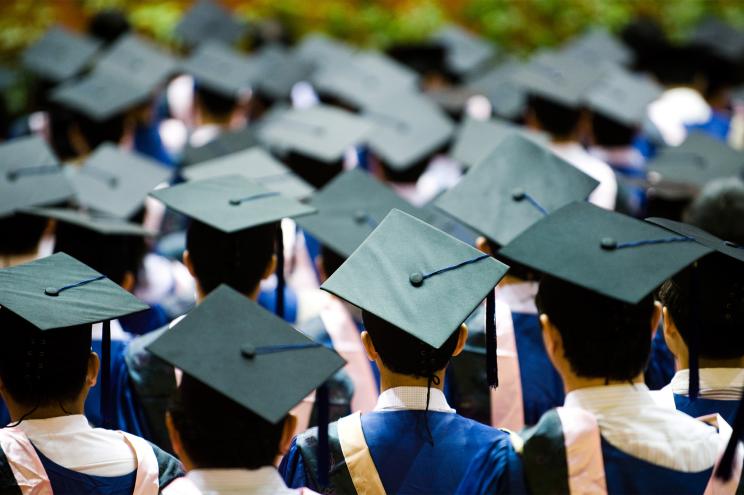 Students with graduate hats on.