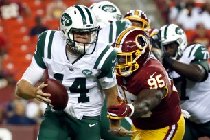 Sam Darnold is sacked by Da'Ron Payne during the first half of the Jets' 15-13 preseason loss Thursday night.