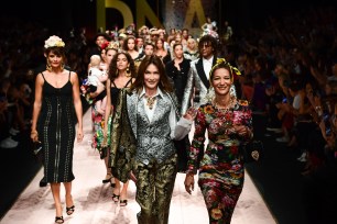 Dolce & Gabbana models walk down the runway.