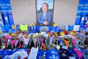 Fans and mourners pay their respects at Leicester City's King Power Stadium.