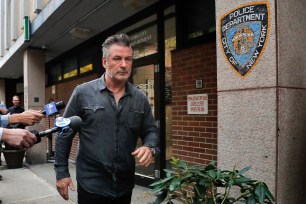 Actor Alec Baldwin walks out of the New York Police Department's 6th Precinct.