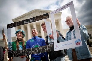 Protesters attend a rally outside the Supreme Court in support of the Juliana v. U.S. lawsuit.