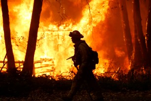Sacramento Metropolitan firefighters battle the Camp Fire in Magalia, Calif.