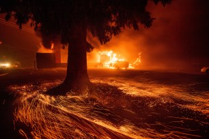 Flames consume a Kentucky Fried Chicken as the Camp Fire tears through Paradise, Calif