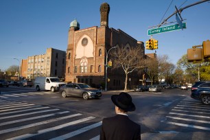 A Jewish boy walks to a yeshiva in Brooklyn.