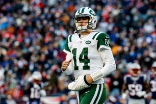 Sam Darnold looks on during the Jets' 38-3 loss to the Patriots on Sunday.
