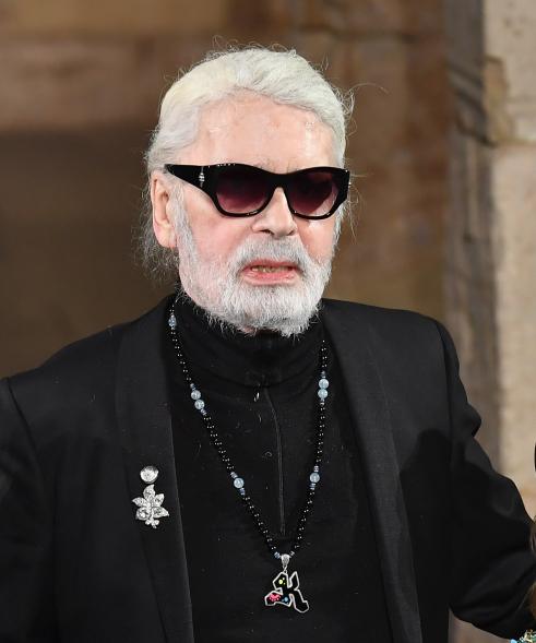 German designer Karl Lagerfeld poses on the runway during the Chanel Metiers D'Art 2018/19 Show at The Metropolitan Museum of Art on December 04, 2018 in New York City. (Photo by Angela Weiss / AFP) (Photo credit should read ANGELA WEISS/AFP/Getty Images)