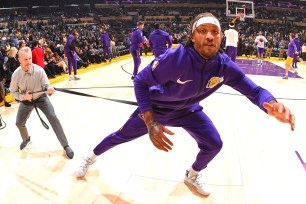 Michael Beasley stretches before a Lakers game in November.