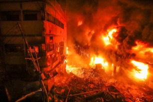 A devastating fire raced through at least five buildings in an old part of Bangladesh's capital and killed scores of people.