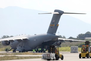 Humanitarian aid is unloaded from an United States Air Force C-17 cargo plane, at Camilo Daza airport in Cucuta, Colombia.