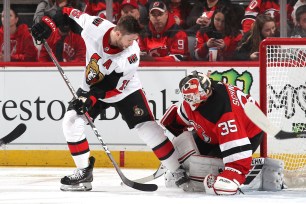 Cory Schneider makes a save on Zack Smith during the Devils' 4-0 win Thursday night.