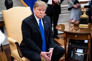 WASHINGTON, DC - FEBRUARY 13 : President Donald J. Trump listens during a meeting with First Lady Melania Trump, the President of the Republic of Colombia Ivan Duque Marquez and Mrs. Maria Ruiz Sandoval in the Oval Office at the White House on Wednesday, Feb. 13, 2019 in Washington, DC. (Photo by Jabin Botsford/The Washington Post via Getty Images)