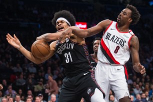 Jarrett Allen is blocked by the Trail Blazer's Al-Farouq Aminu during the Nets' 113-99 loss Thursday.