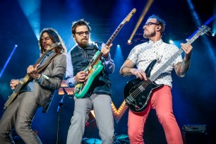 Brian Bell, Rivers Cuomo and Scott Shriner of Weezer.