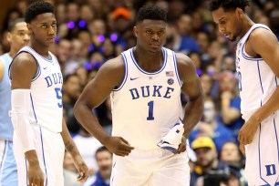 Zion Williamson with busted sneaker in hand