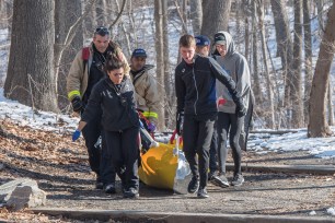 Fordham University runners assist FDNY EMT responders rescue a man in a Bronx park.