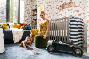 Brett Eleanor Helsham is pictured with her baby, Max, in her own designed wallpaper nursery at home.