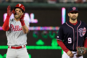 Bryce Harper celebrates a sixth-inning single in his return to Washington as a Phillie on Tuesday night. He also doubled and homered in a 3-for-5 effort in the Phillies' 8-2 win.