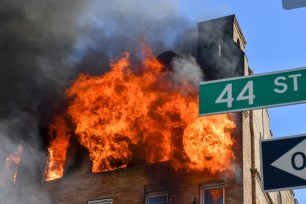 Firefighters battle a massive blaze at a Brooklyn apartment building.