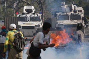 Venezuelan protesters storming the streets of Caracas.
