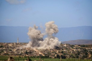 Smoke rising after Syrian government and Russian airstrikes that hit the town of al-Habeet, southern Idlib, Syria.