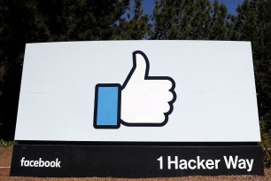 A sign leading to Facebook's company's headquarters in Menlo Park, Calif.