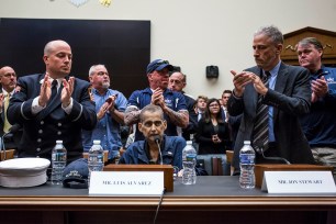 Luis Alvarez is applauded by fellow first responders, as well as Jon Stewart, during a House Judiciary Committee on the 9/11 Victim Compensation Fund