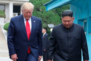 Donald Trump and Kim Jong Un cross the border line at the border village of Panmunjom in Demilitarized Zone.