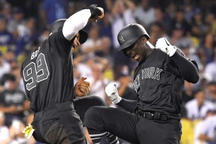 Didi Gregorius celebrates with Aaron Judge after he belted a grand slam in the fifth inning of the Yankees' victory over the Dodgers on Friday night.