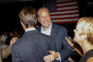 Dan Bishop greets supporters at a campaign event in Monroe, N.C., on Tuesday.